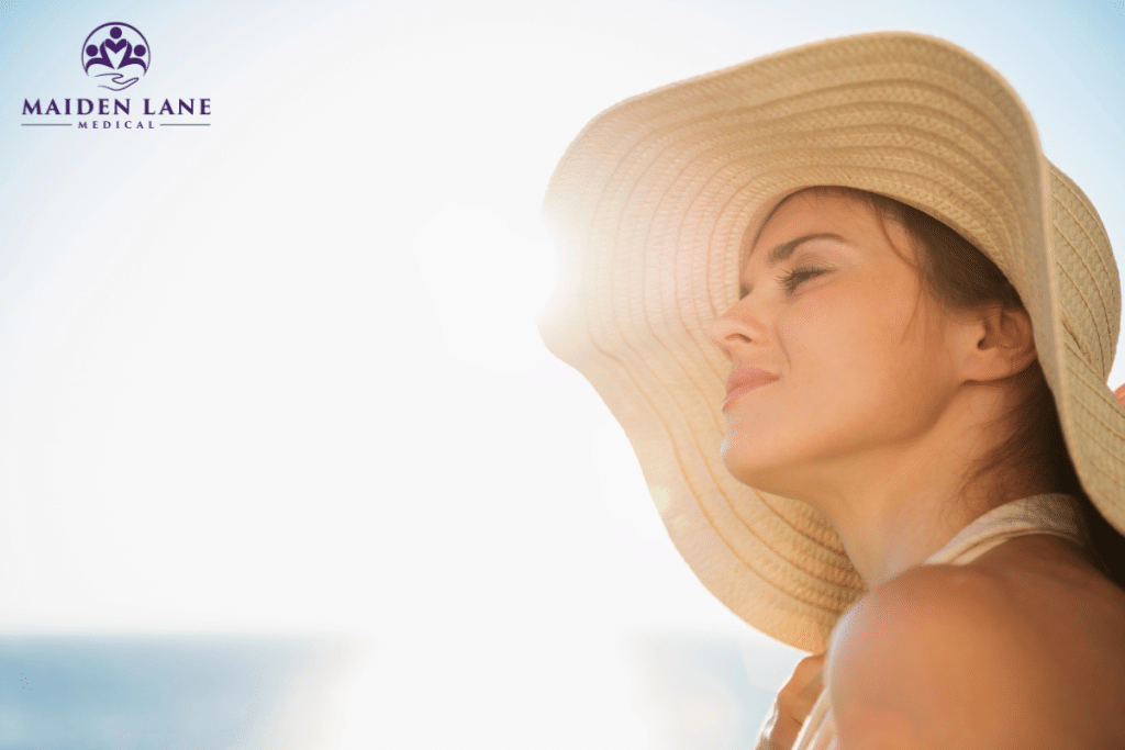 A woman enjoying sunshine at the beach in Manhattan, New York.