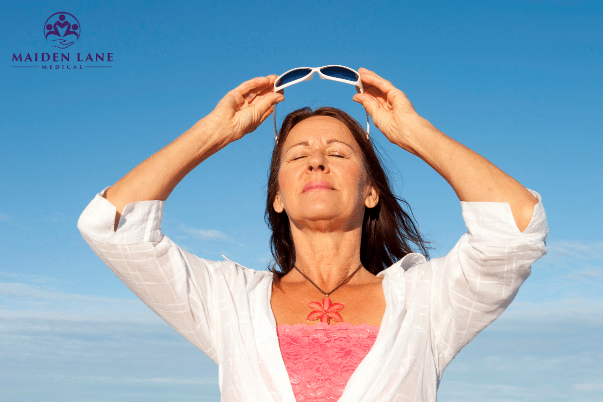 A woman taking in Vitamin D from the sun in Manhattan, New York.
