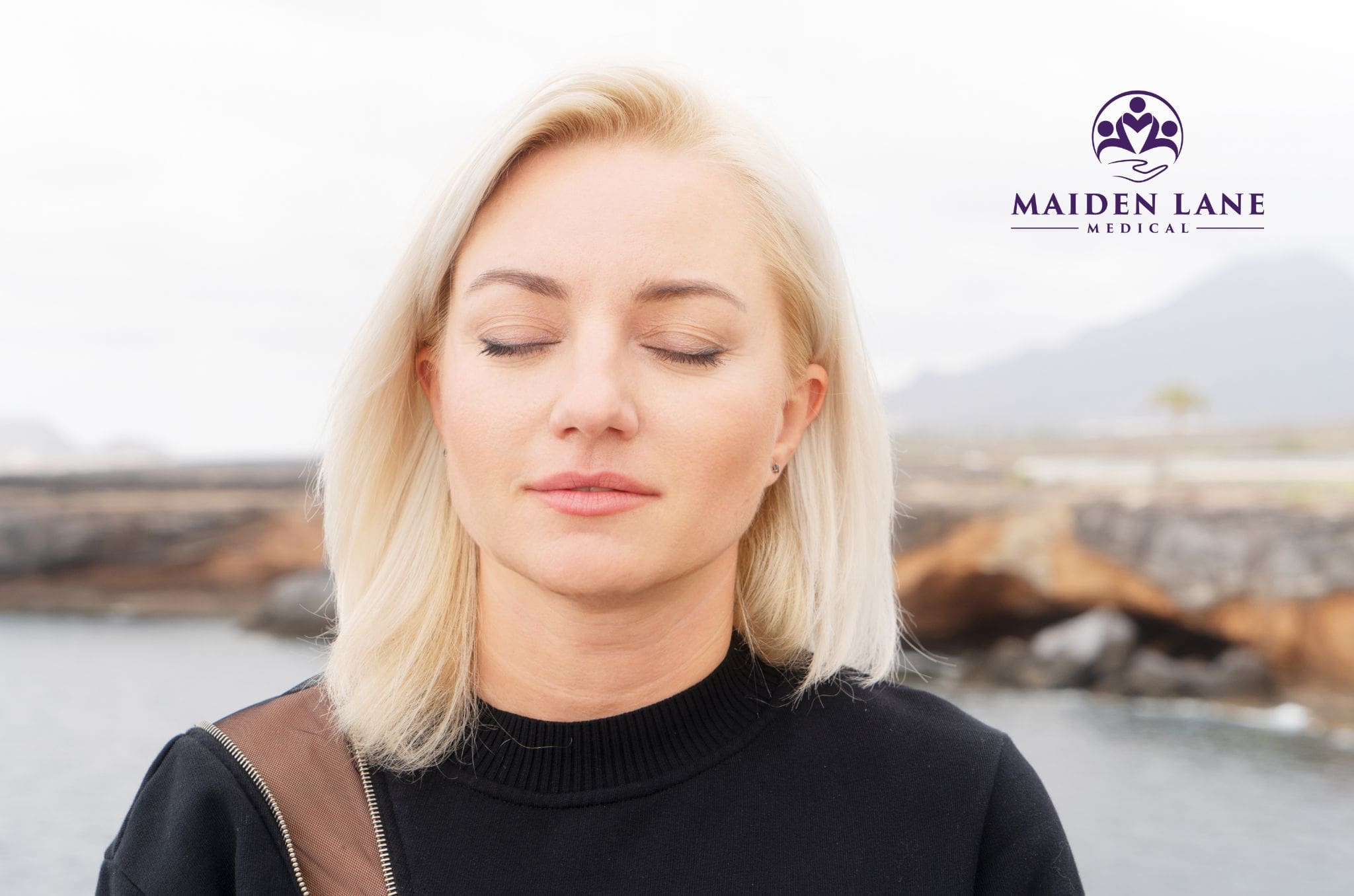 A woman trying Bellows breath exercises outside in NYC.