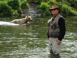 Dr. Kaufman in lake with bear in water