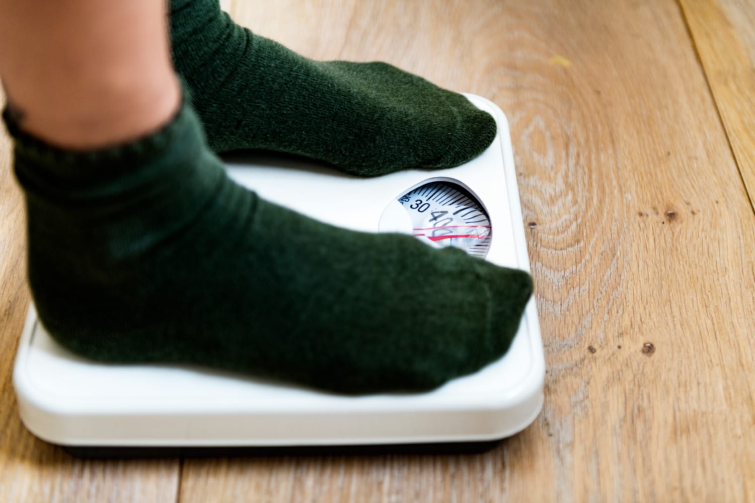 Feet on a weight scale checking for weight loss - Maiden Lane Medical, NY