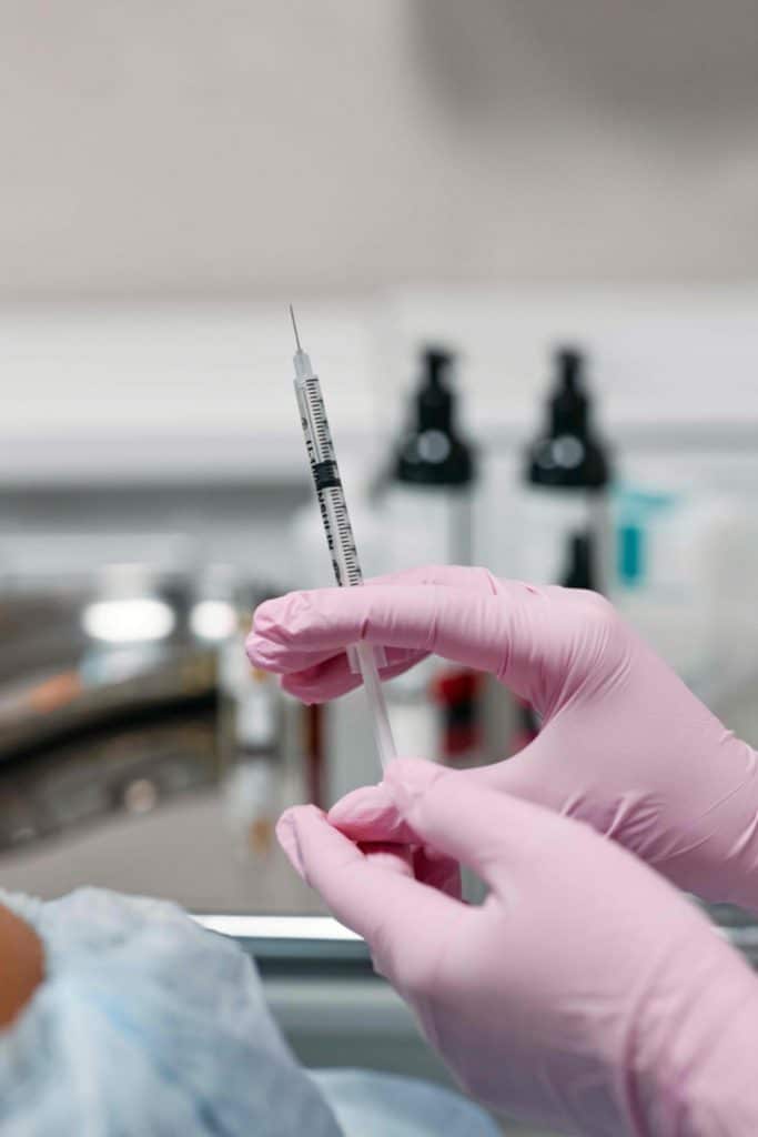 Doctors hands holding a botox injection. - Maiden Lane Medical I New York, NY