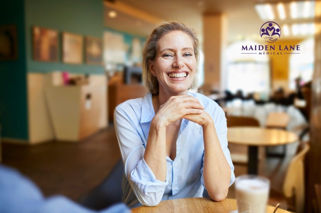 Happy female patient after visiting adenomysis specialist at Maiden Lane Medical.