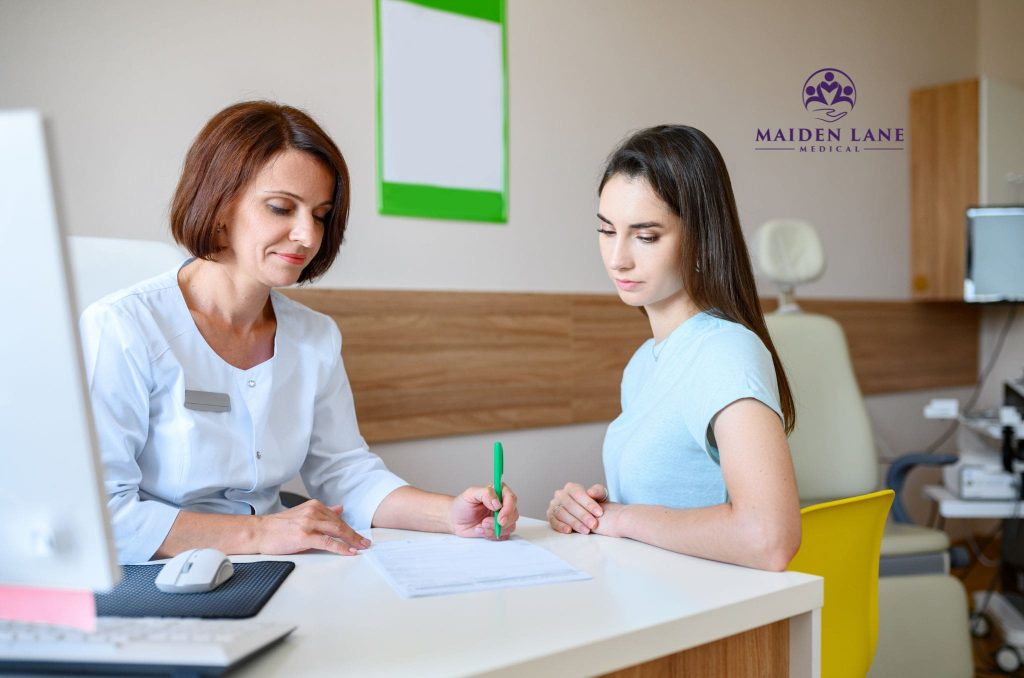 A female patient visiting a gynecologist in Manhattan, NY regarding endometrial polyps.
