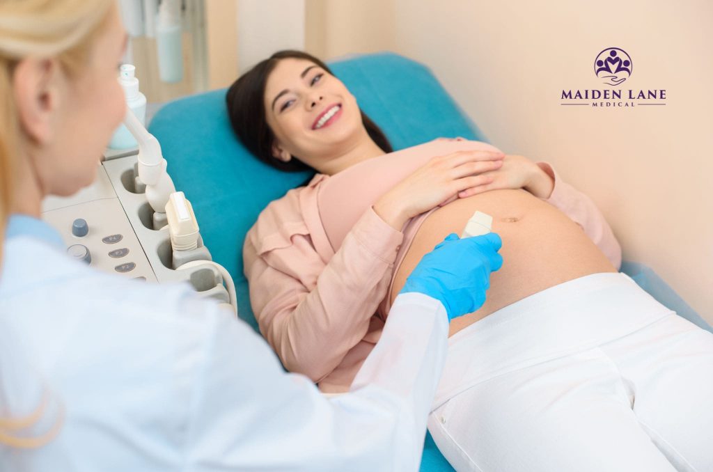 A pregnant woman having an obstetrical ultrasound in Manhattan, NY.