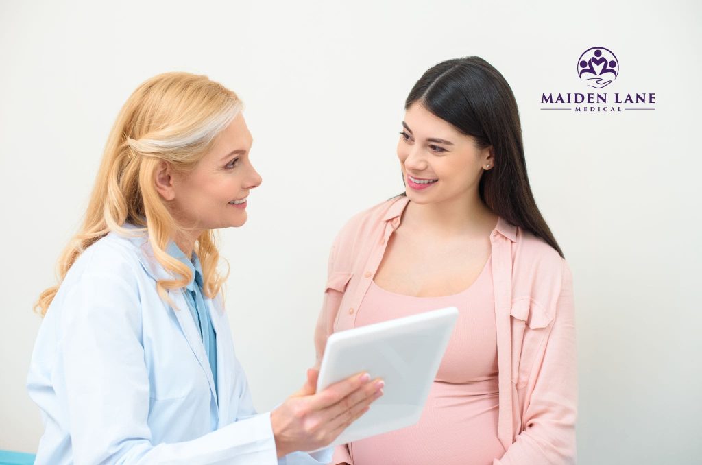 A pregnant woma visiting her OB/GYN in Manhattan, NY.