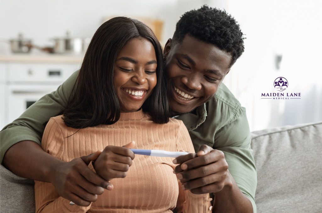 A newly pregnant woman wondering what to expect from her first prenatal visit.