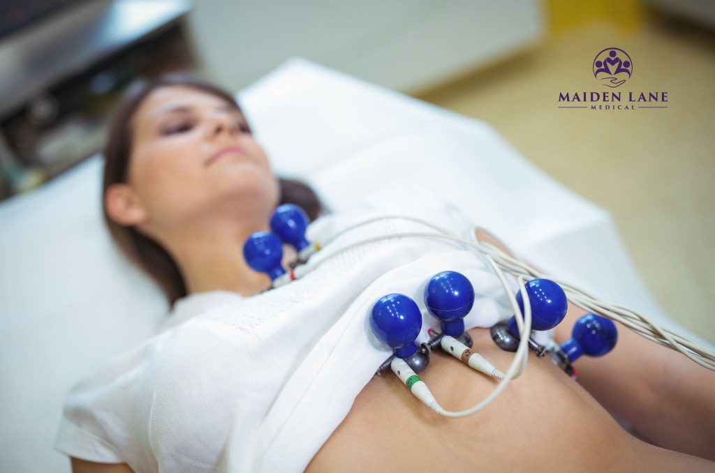 A woman having her heart checked with an ECG test in Manhattan, NY.
