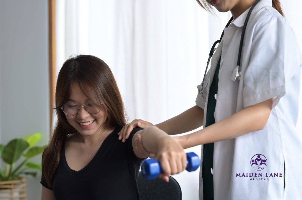 A woman getting physical therapy after seeing a herniated disc specialist in Manhattan, NY.