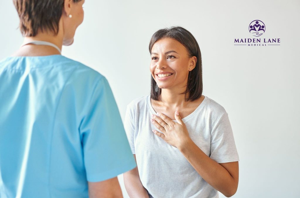 A happy woman after seeing an abnormal uterine bleeding specialist in Manhattan, NY.