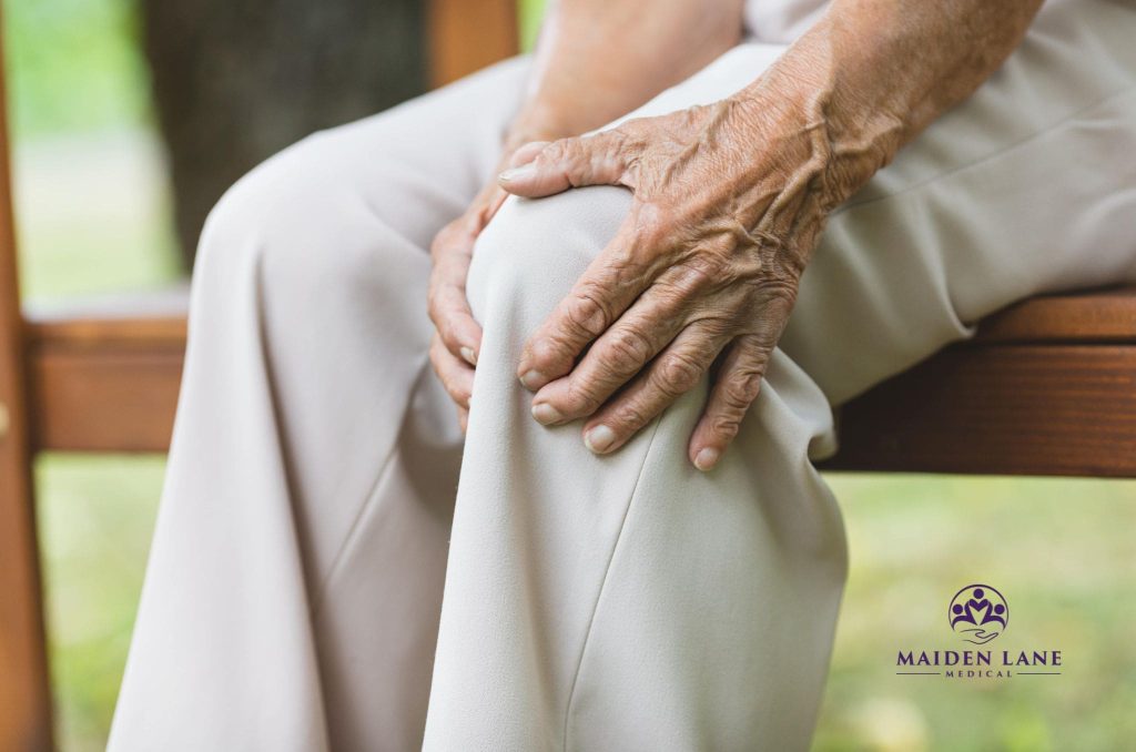 An older woman needing to see a joint pain specialist in NYC.