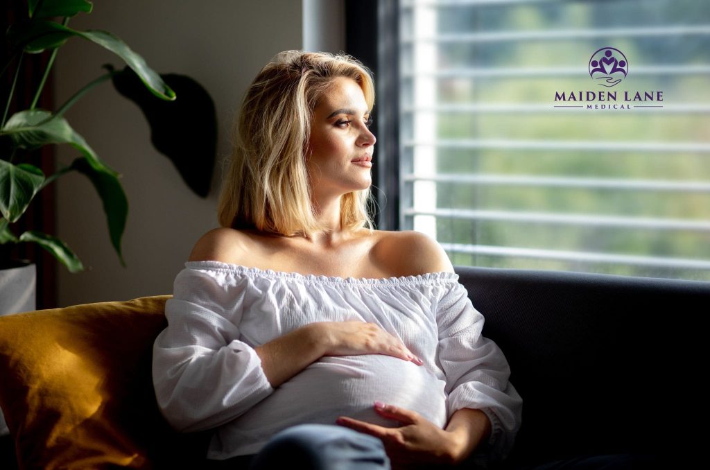 A happy pregnant woman after her successful myomectomy in Manhattan, NY.