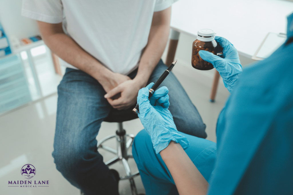 A man getting medication from a doctor for prostatitis treatment in Manhattan, New York.