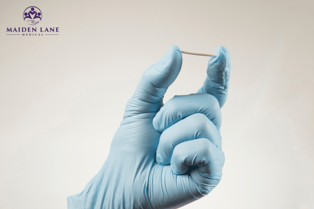 A gloved hand holding nexplanon in Manhattan, New York.