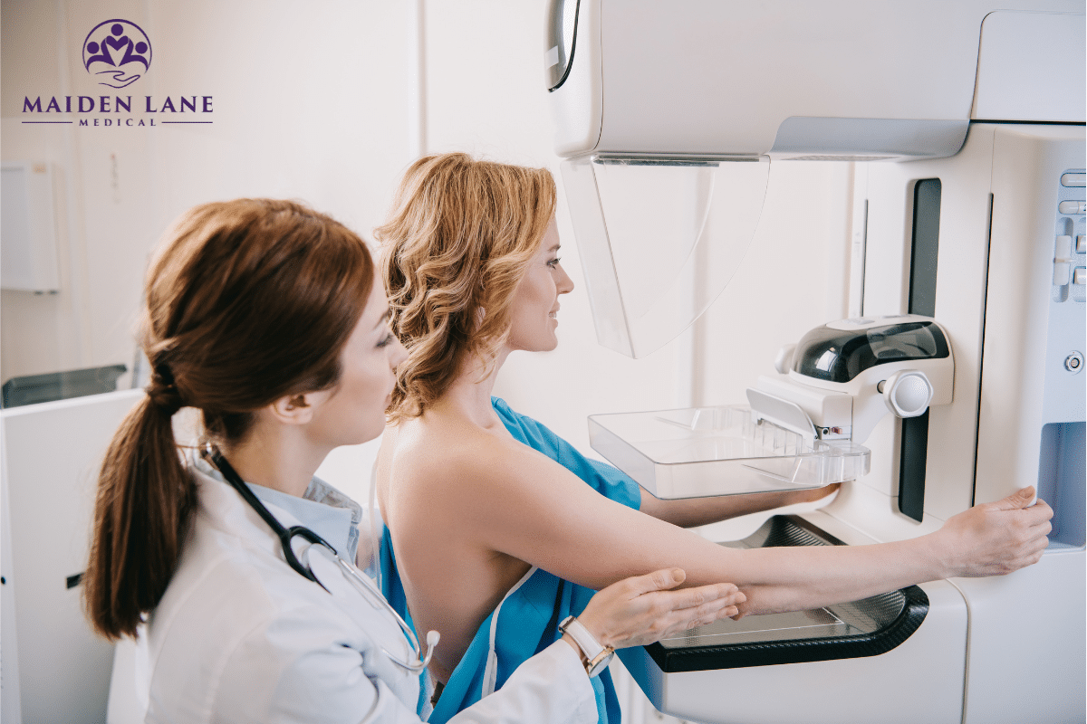 A doctor assisting a woman to take a mammogram test in Manhattan, New York.