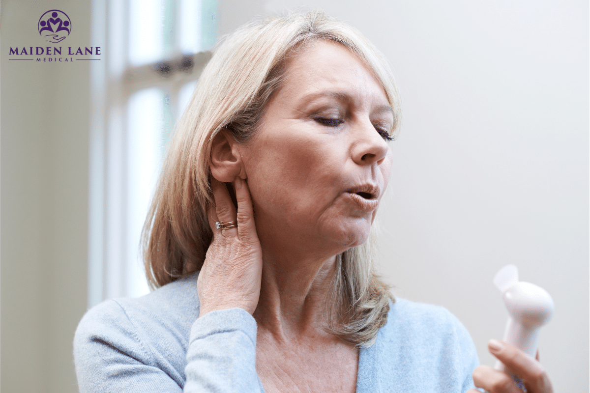 A woman experiencing hot flashes caused by menopause in Manhattan, New York.