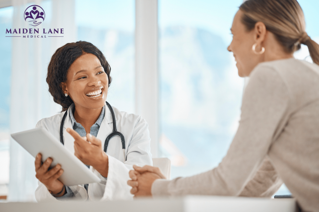 A happy patient consulting a doctor on office-based treatment in Manhattan, New York.